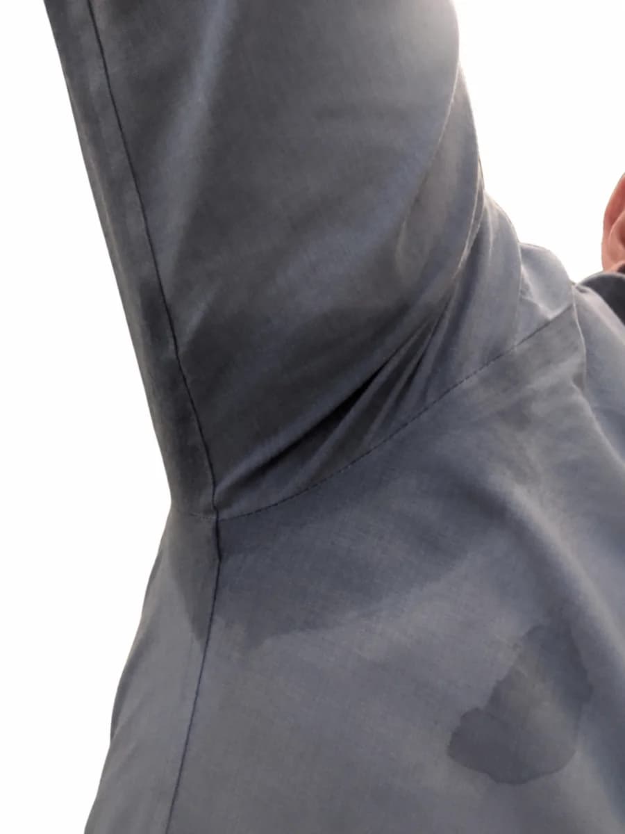 A damp patch visible on the outside of the documented garment over the CANAGROW pad position.